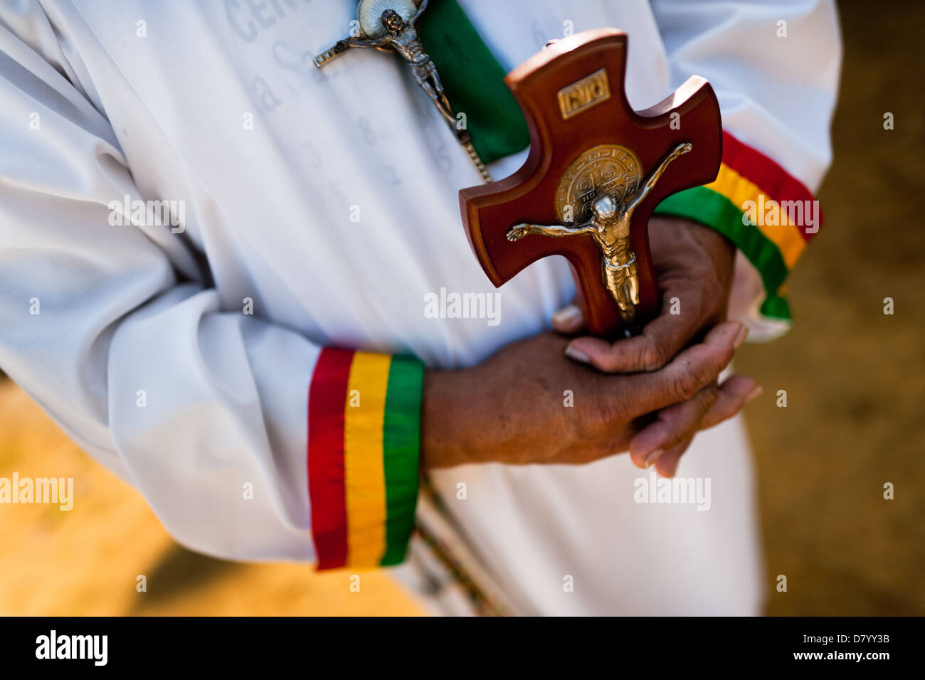 Hermes Cifuentes, a Colombian spiritual healer, helds a crucifix in hands during a ritual of exorcism in La Cumbre, Colombia. Stock Photo