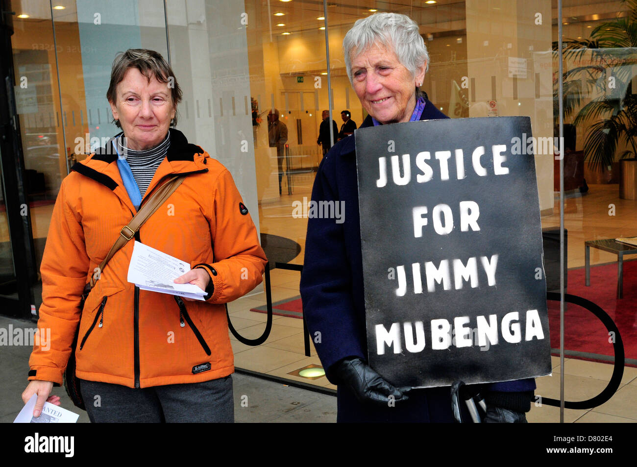 Protesters outside the security company G4S with a placard reading 'justice for Jimmy Mubenga'. London, UK Stock Photo