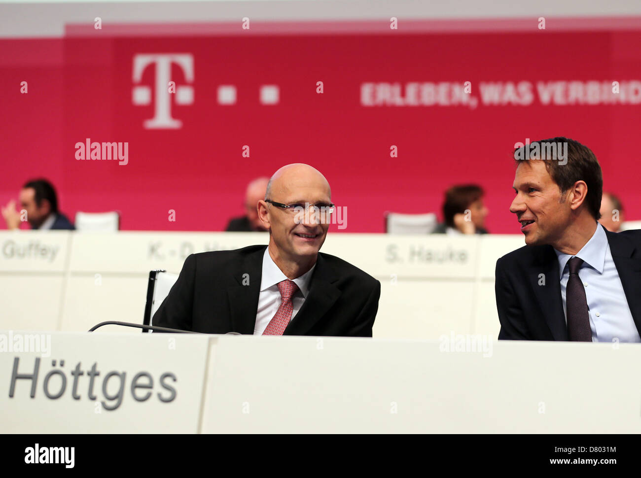 Deutsche Telekom CFO Timotheus Hoettges (L) sits next to chairman of ...