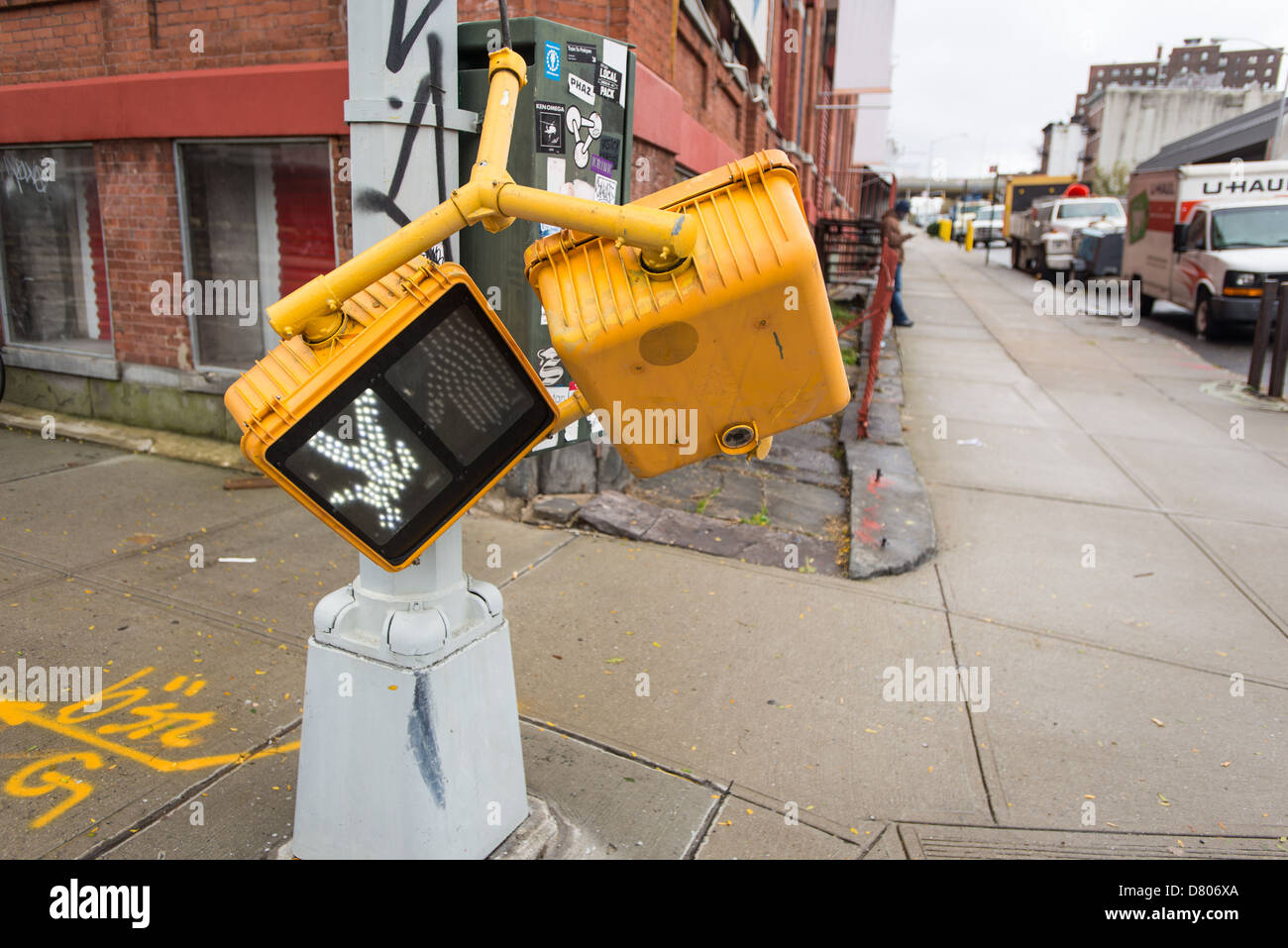 Effects of Hurricane Sandy. Broken--yet still working--walking signal on Flushing Ave., Brooklyn, NYC, Oct 30, 2012. Stock Photo
