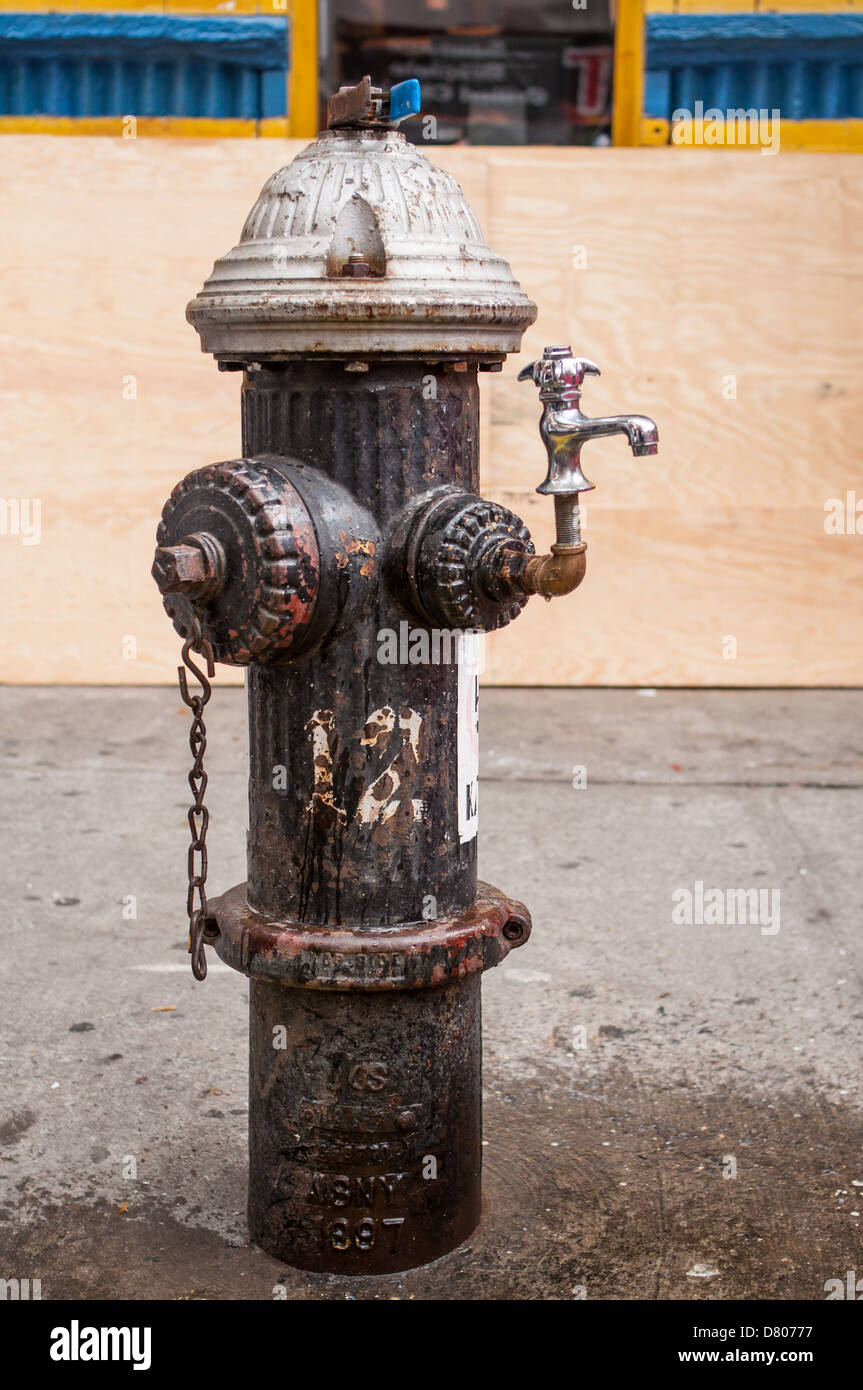 A fire hydrant with a drinking fountain attached. Stock Photo