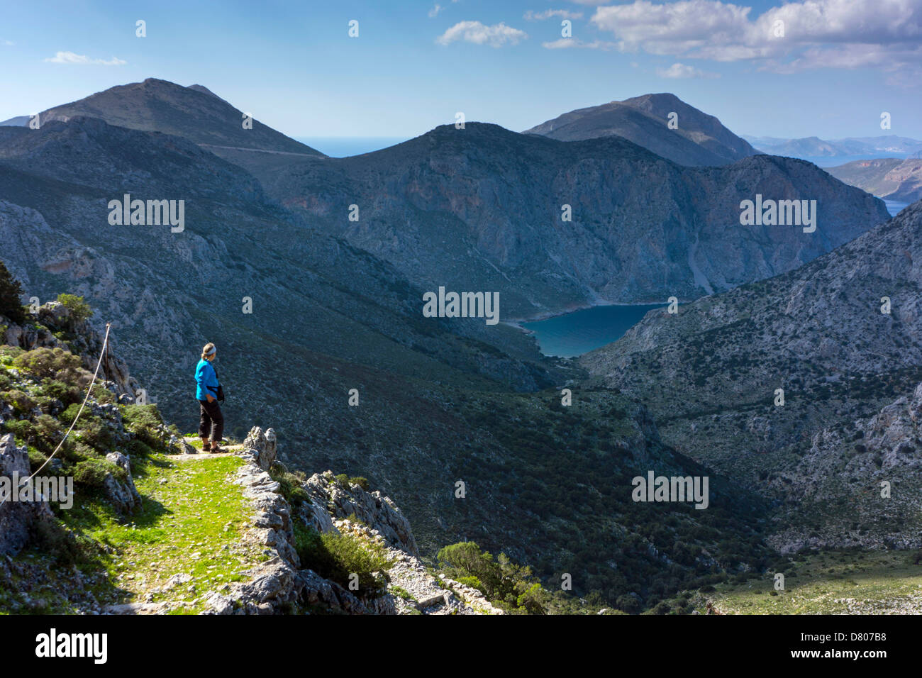 Solitary figure in mountainous landscape, Kalymnos, Greece Stock Photo