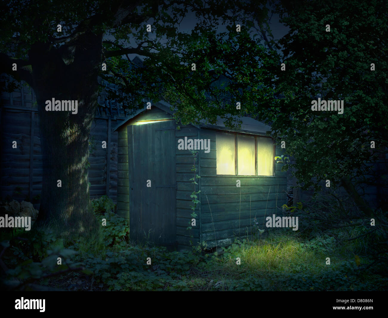 Illustration of illuminated shed in garden Stock Photo