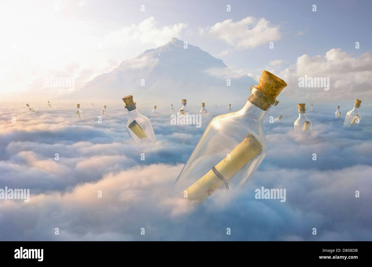 Messages in bottles floating in clouds Stock Photo