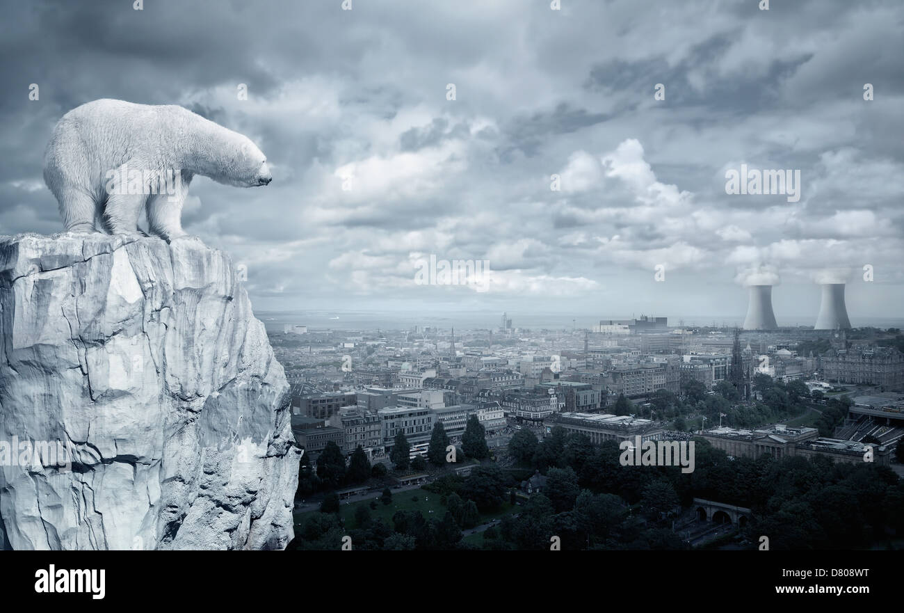 Polar bear overlooking cityscape from glacier Stock Photo