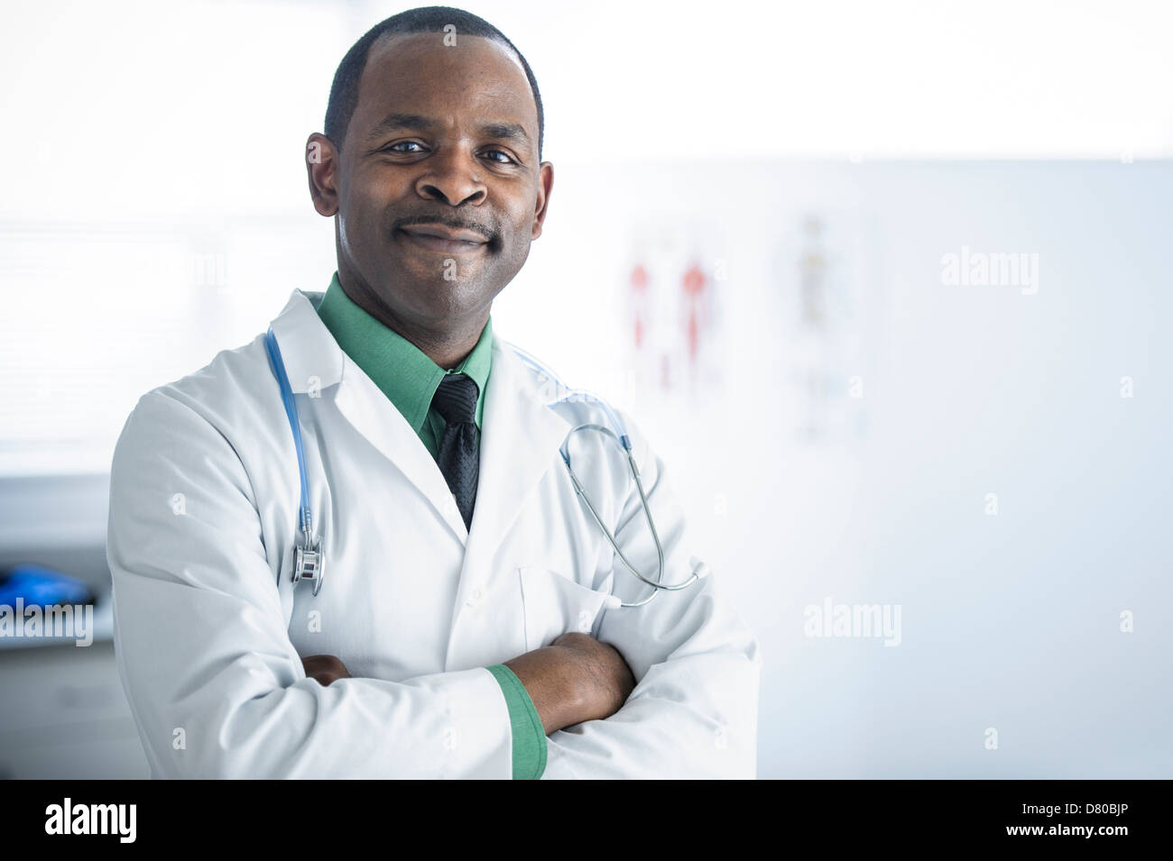 African American doctor smiling in office Stock Photo