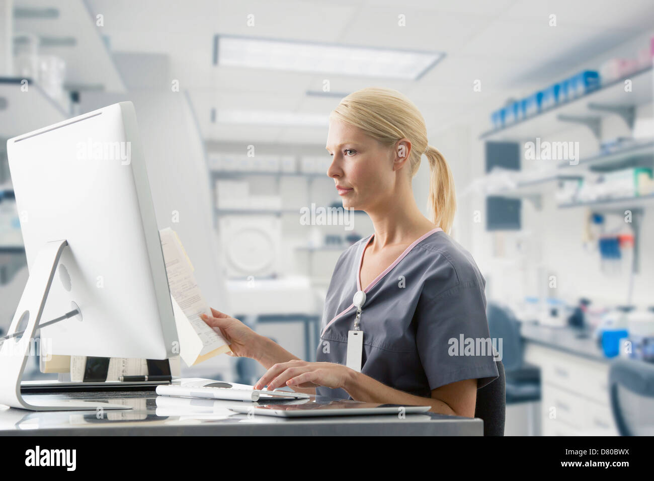 Caucasian nurse working at computer in hospital Stock Photo Alamy