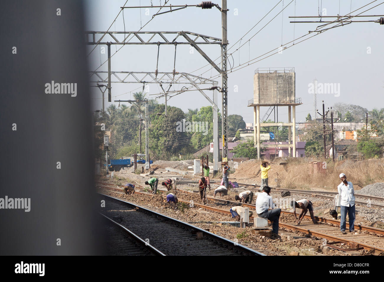 Men working on a train track in India Stock Photo Alamy