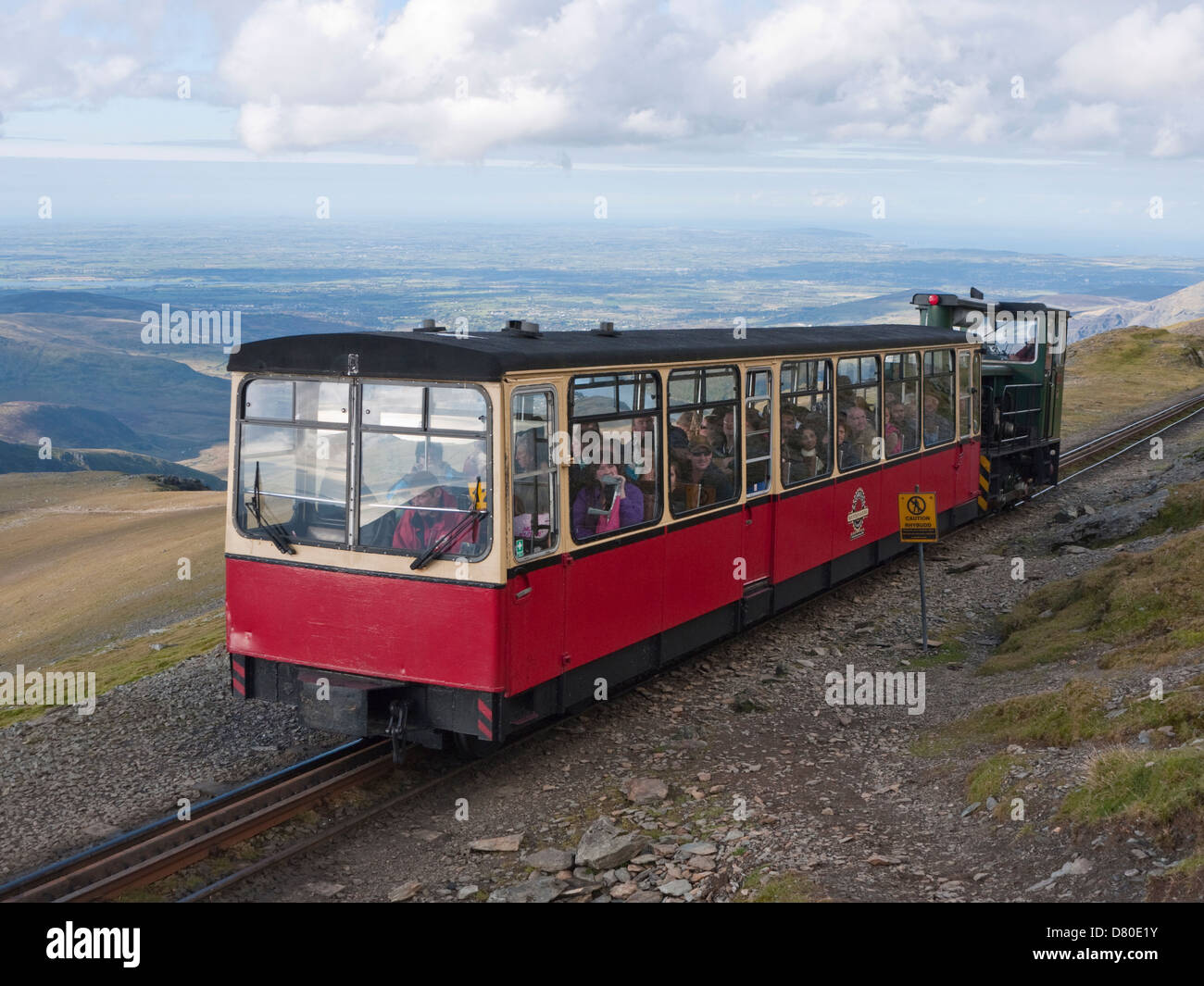 Snowdon Mountain Railway train on the final pull to Snowdon's summit Stock Photo