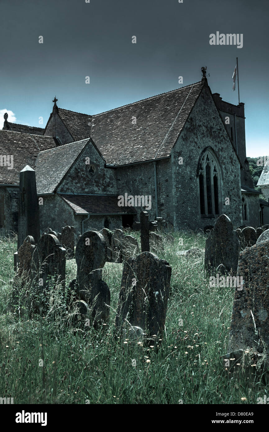 Unkempt overgrown gravestones in a country churchyard Stock Photo