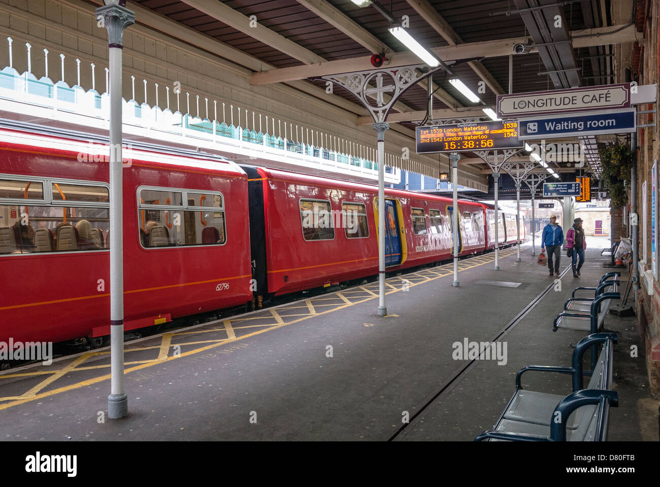 Platform with stationary train at Clapham Junction Stock Photo Alamy