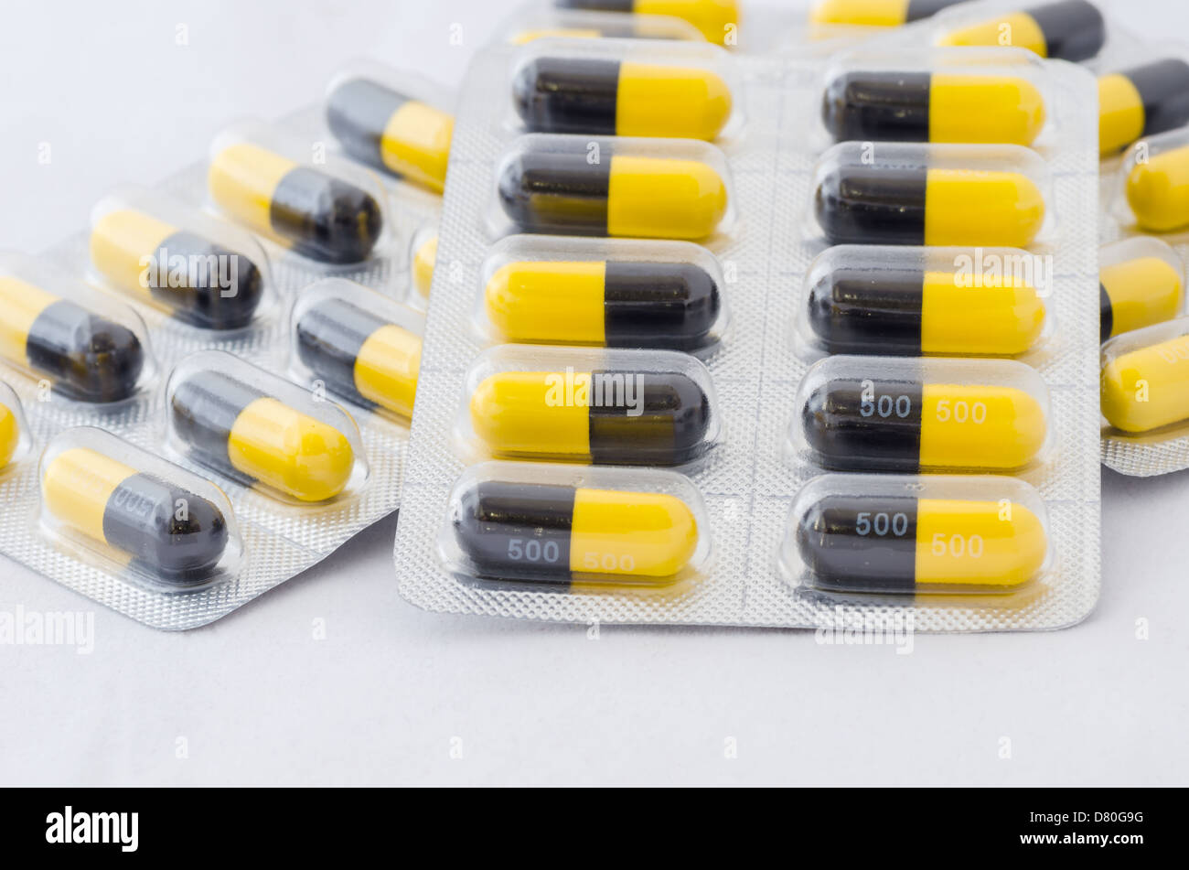 Black and yellow capsule pack medicine heath concept Stock Photo Alamy