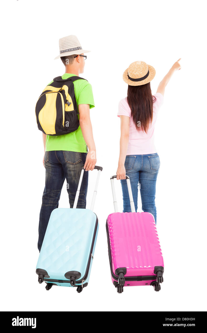 happy couple tourist with travel suitcase and pointing something Stock Photo