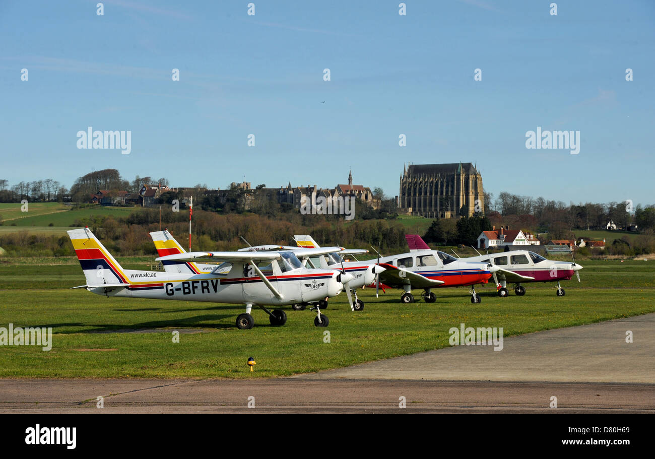 Light aircraft parked at Brighton and Shoreham City Airport with Lancing College behind Stock Photo
