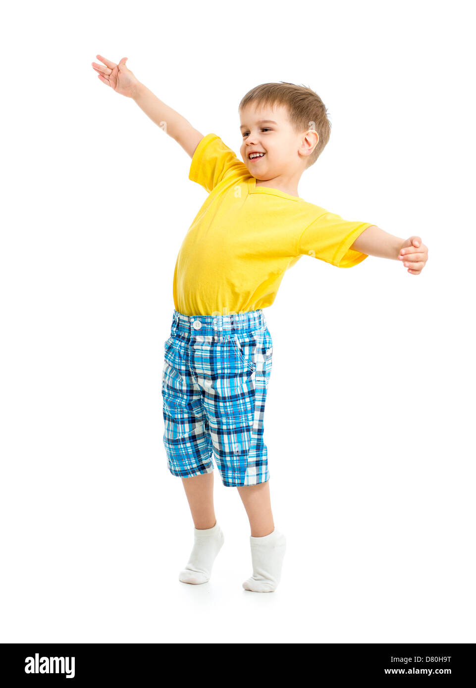 Funny kid boy with open arms isolated on white studio shot. Stock Photo