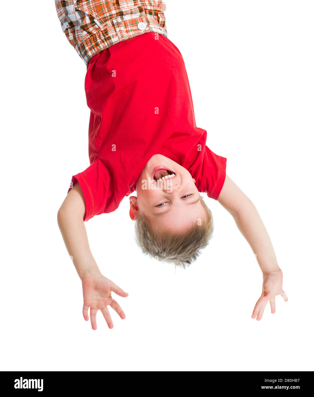 kid boy upside down isolated on white Stock Photo