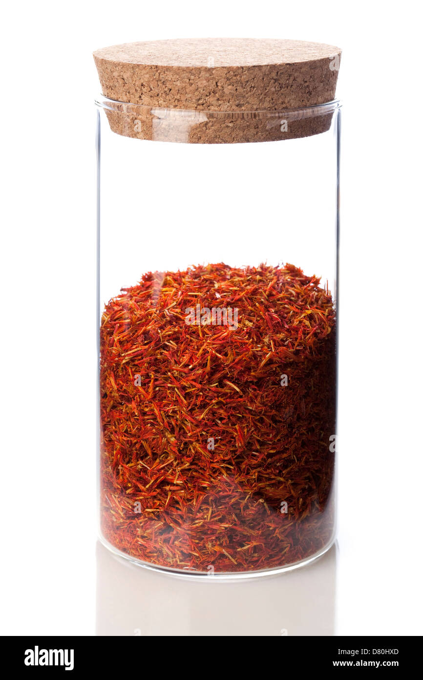 Chinese medicinal herb honghua in glass bottle Stock Photo - Alamy