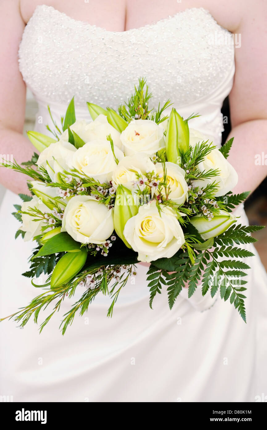 Closeup of brides white roses on wedding day Stock Photo - Alamy