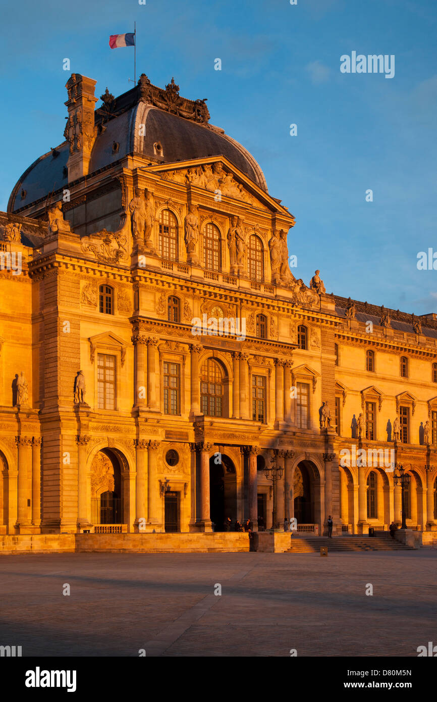 Last few moments of setting sunlight on Palais du Louvre, Paris France Stock Photo
