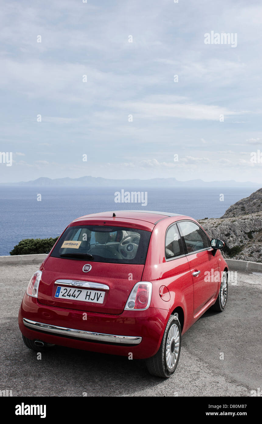 Rear view of a red Fiat 500 car in Majorca, Spain. Stock Photo