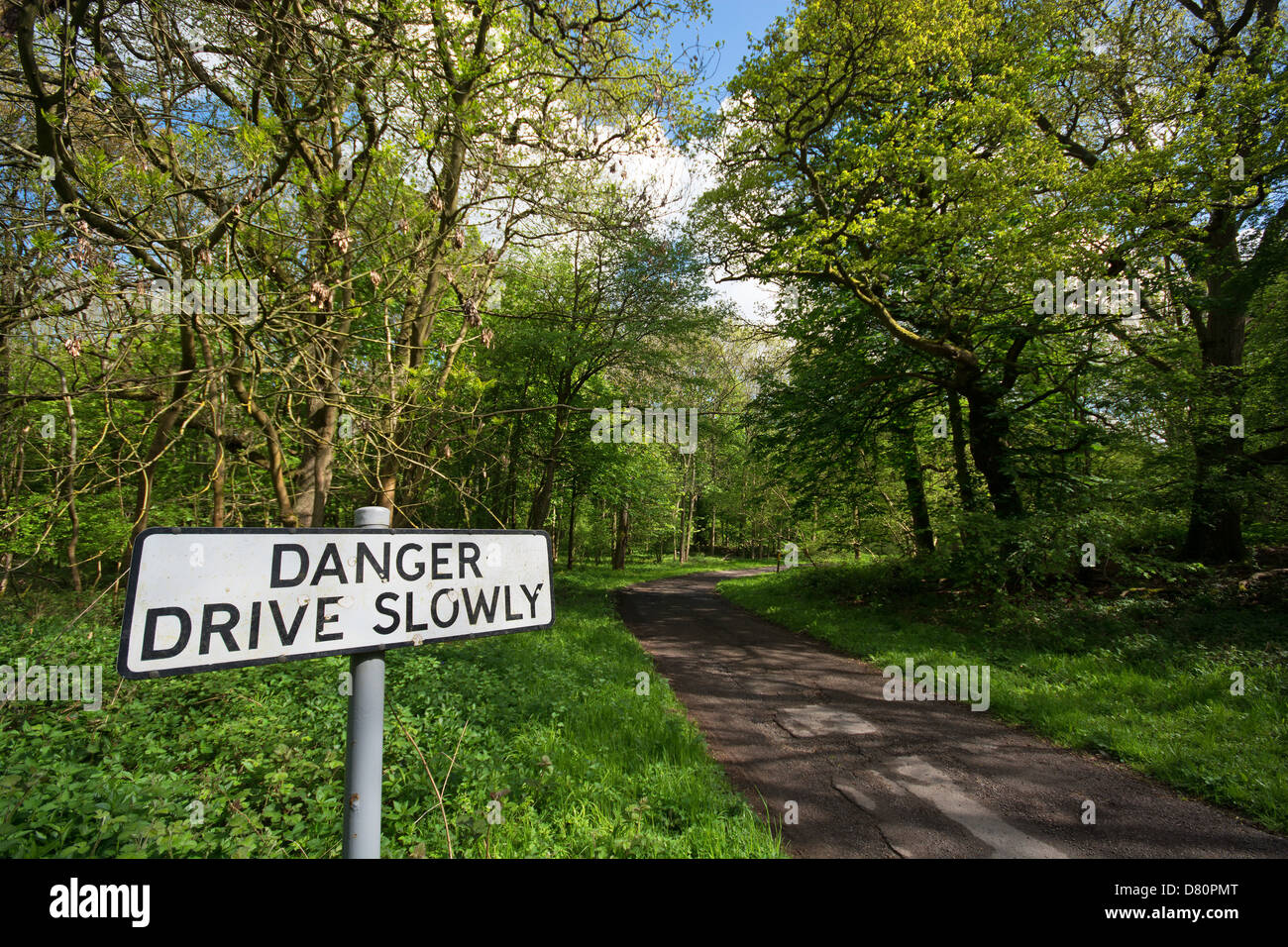 A sign warning motorists to drive slowly on a narrow country lane. UK, 2013. Stock Photo