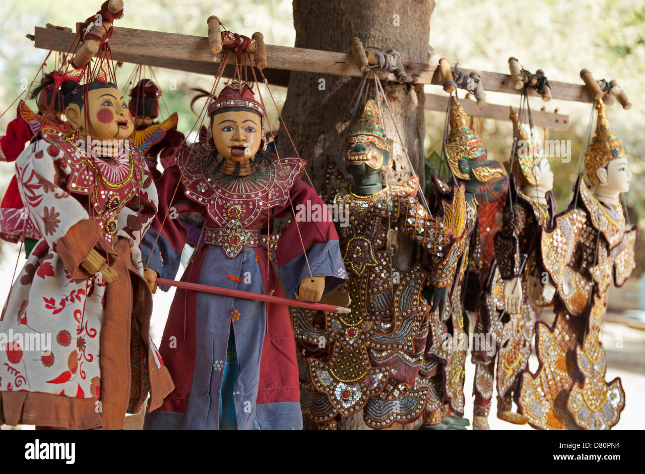 Puppets hanging from a tree in Mingun, Myanmar Stock Photo