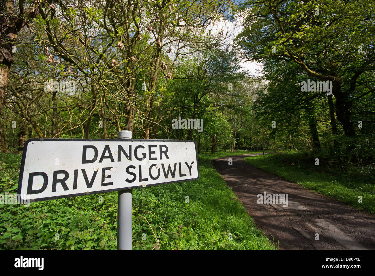 A sign warning motorists to drive slowly on a narrow country lane. UK, 2013. Stock Photo