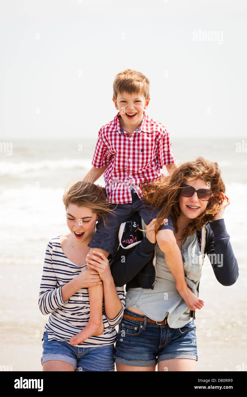 Family of 3 playing at beach Stock Photo