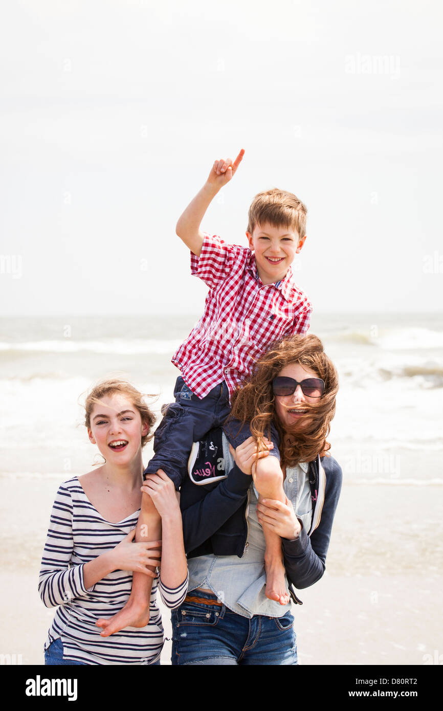 Family of 3 playing at beach Stock Photo