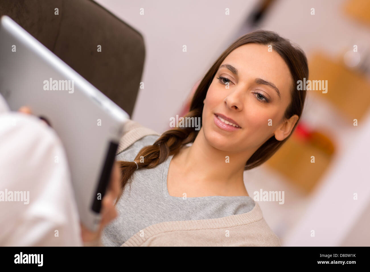 Pretty female at home on internet Stock Photo