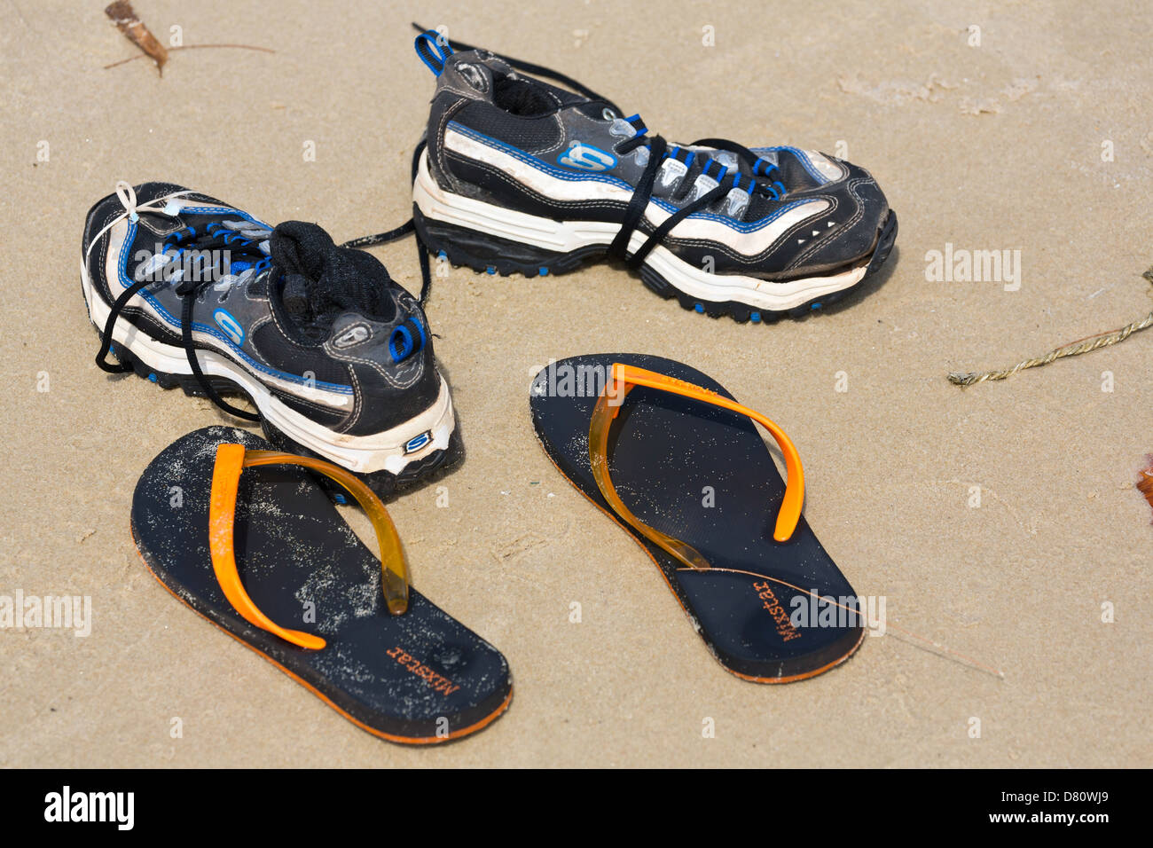Shoes on Serendipity Beach in Sihanoukville, Cambodia Stock Photo