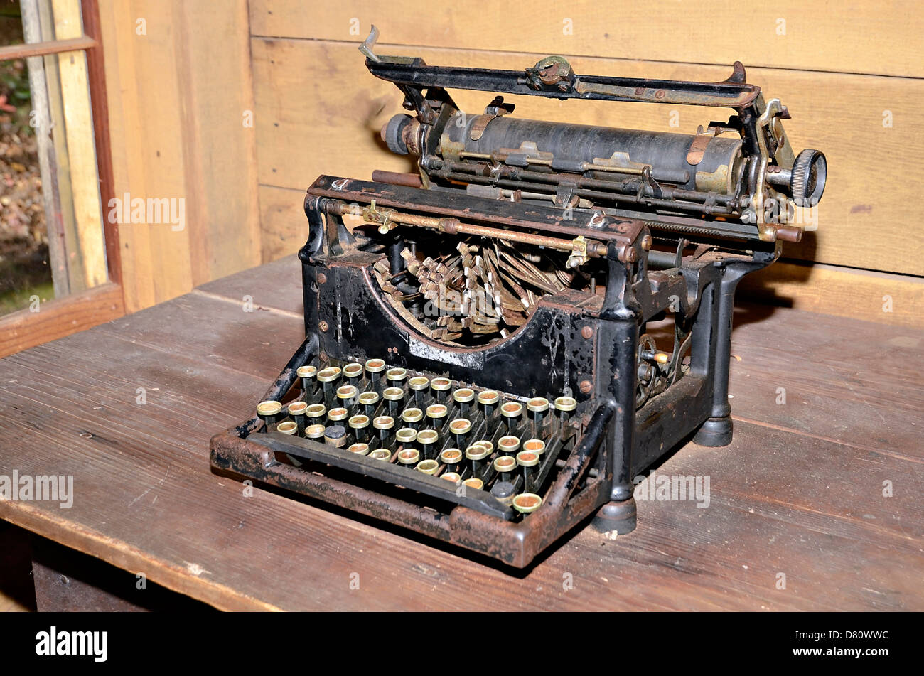 An old typewriter on display in a vintage setting. Stock Photo