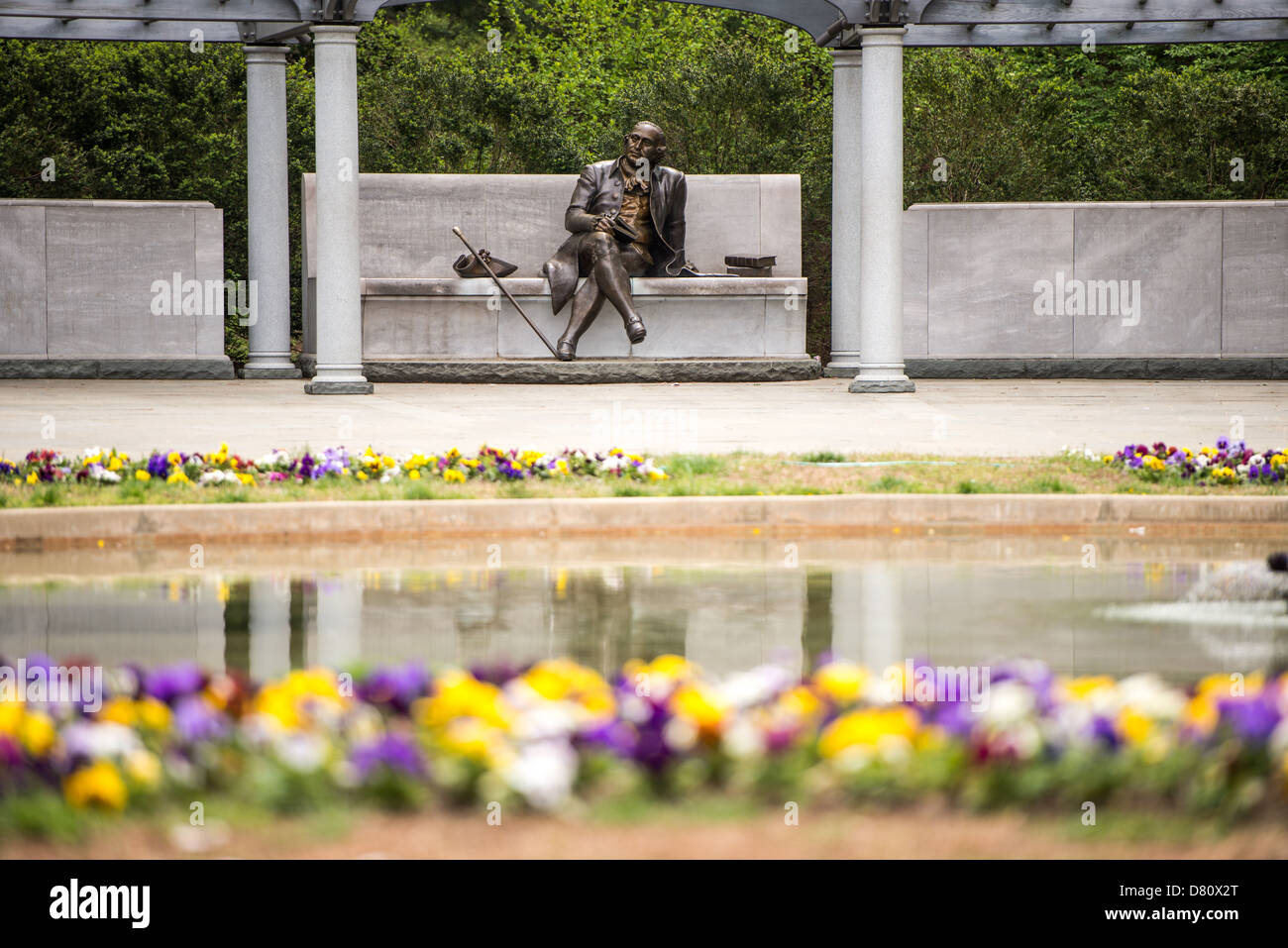 WASHINGTON DC, USA - The statue, with flowers in the foreground, at the George Mason Memorial in Washington DC in Potomac Park near the Jefferson Memorial. The memorial honors one of the lesser known Founding Fathers. Stock Photo