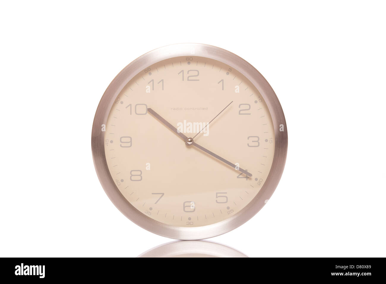 Silver wall clock isolated on white background Stock Photo - Alamy