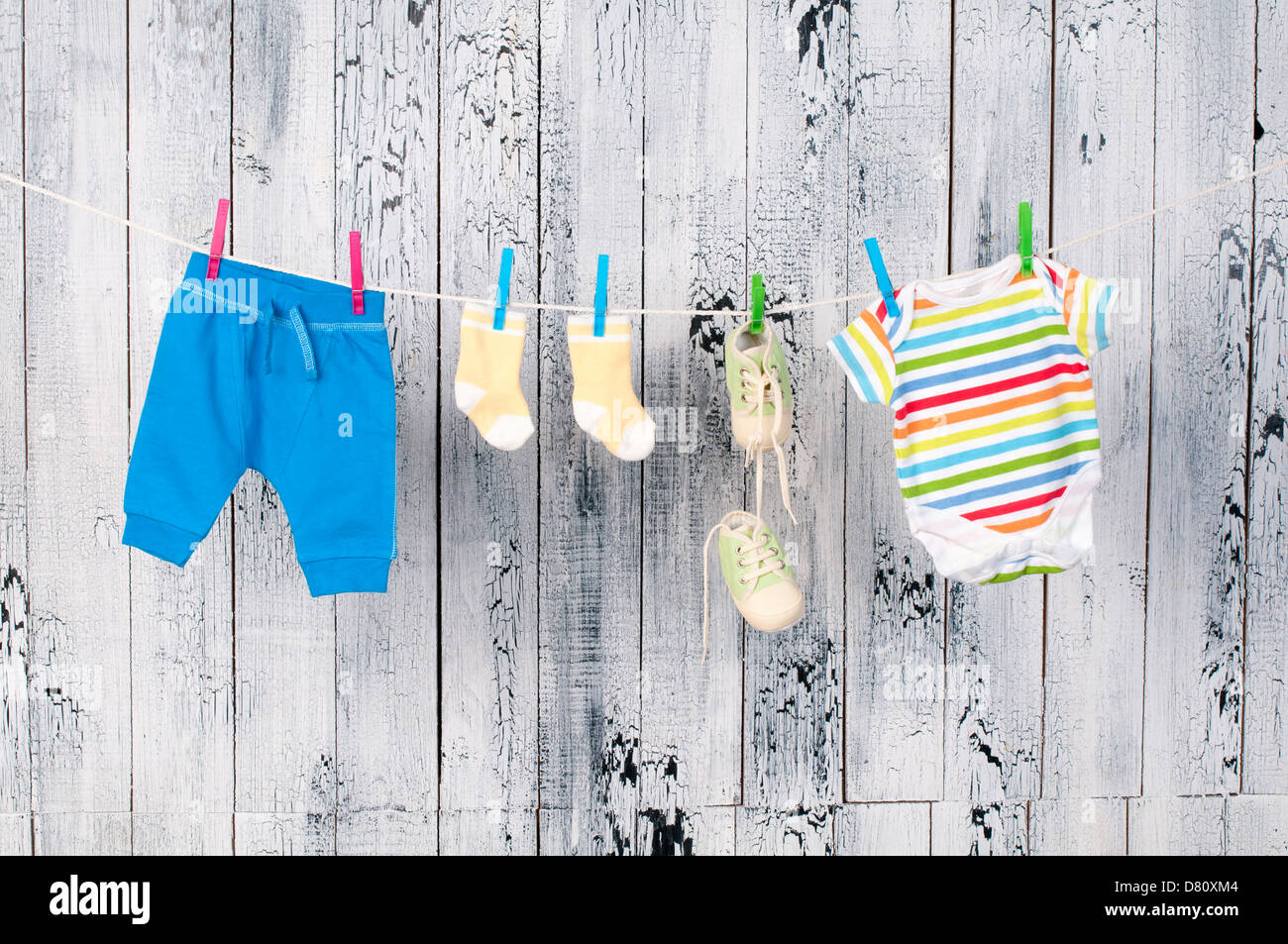 Baby clothes hanging on the clothesline Stock Photo Alamy