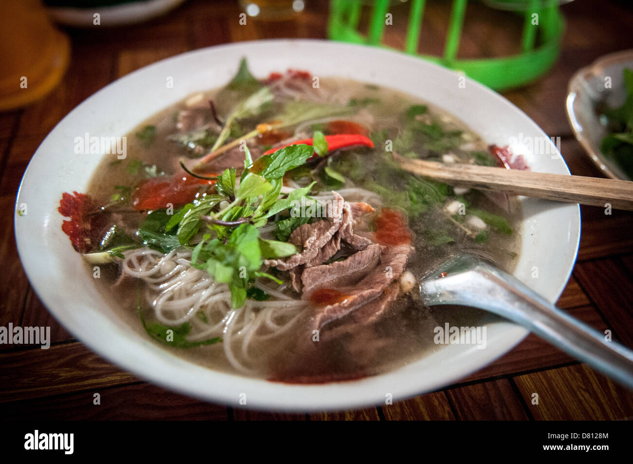A fresh bowl of beef noodle soup, a staple of Lao cuisine, in a morning market in northern Laos