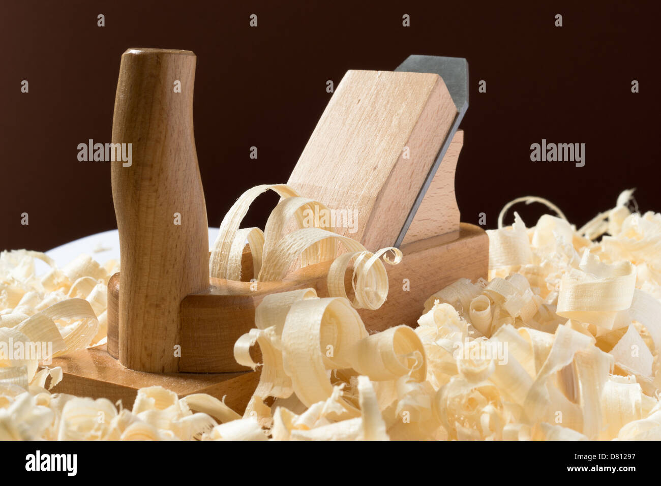 Wooden jointer plane with light shavings Stock Photo Alamy