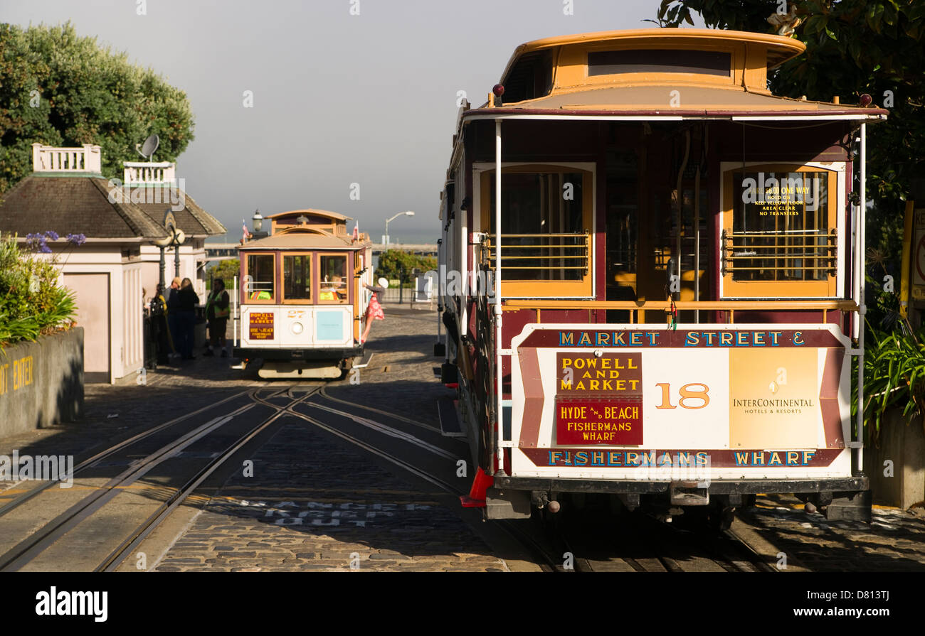 The Number 18 Hyde and Beach Trolley waits while another car is loaded getting ready to head up the hill on an early morning in Stock Photo