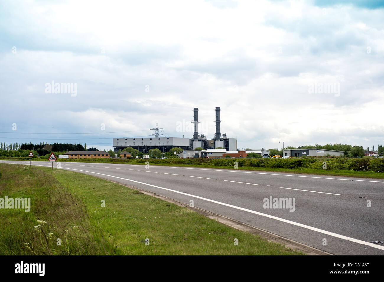 Long shot of Spalding Power Station with the A16 in the foreground. No cars. Stock Photo