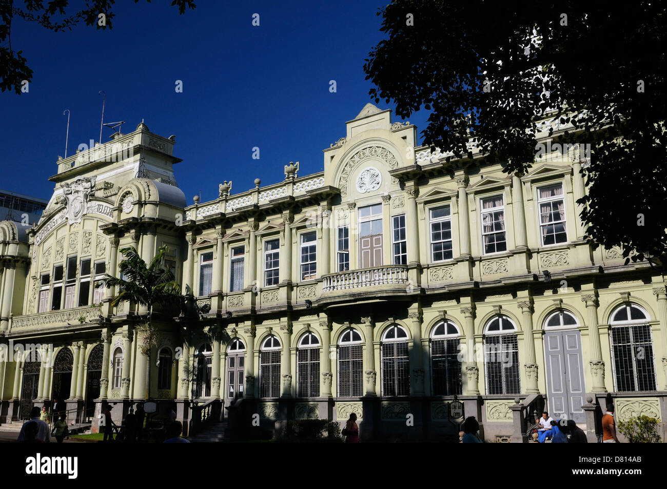 Main classic post office building in San Jose Costa Rica with morning sun and blue sky Stock Photo