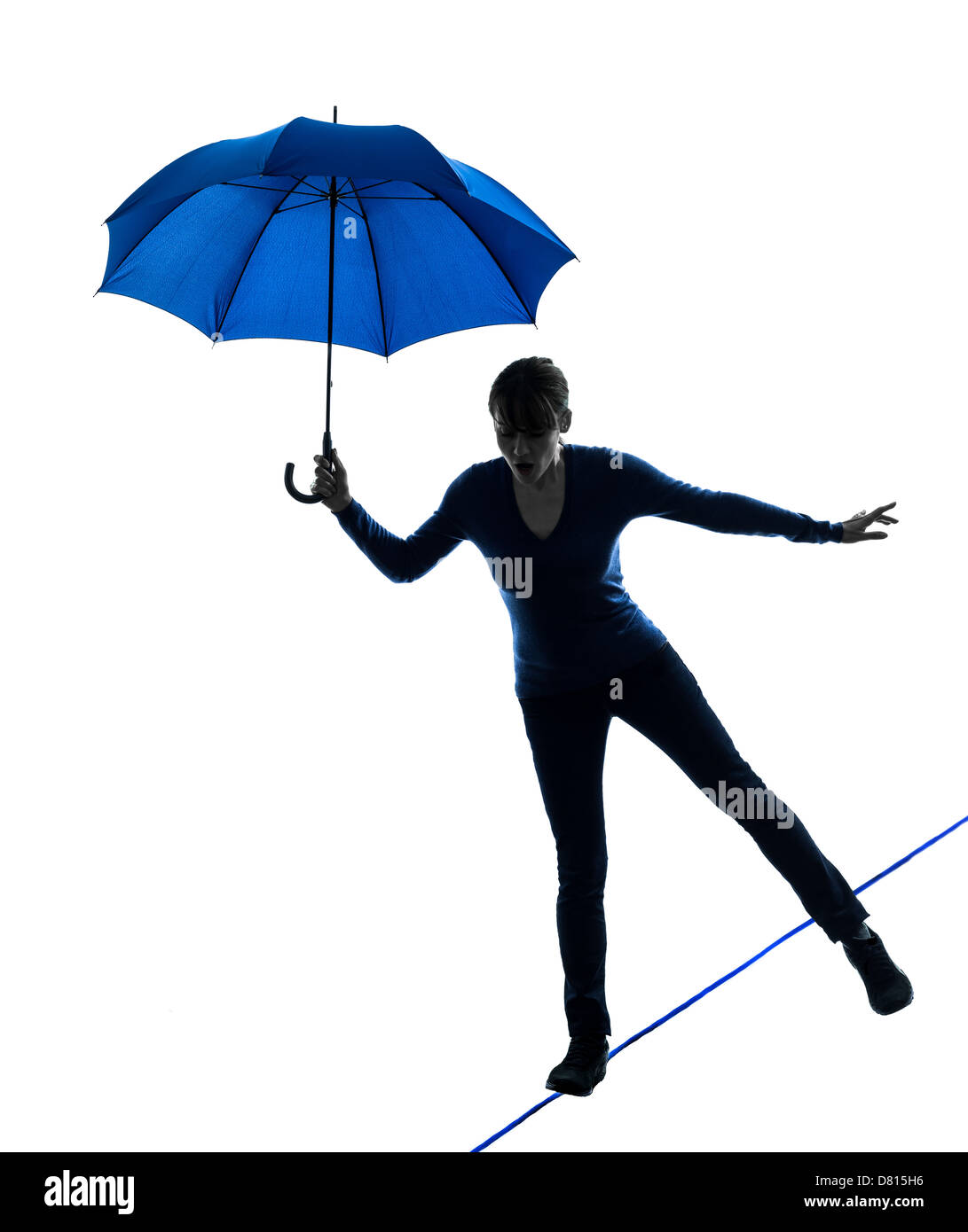 one  woman holding umbrella in silhouette studio isolated on white background Stock Photo