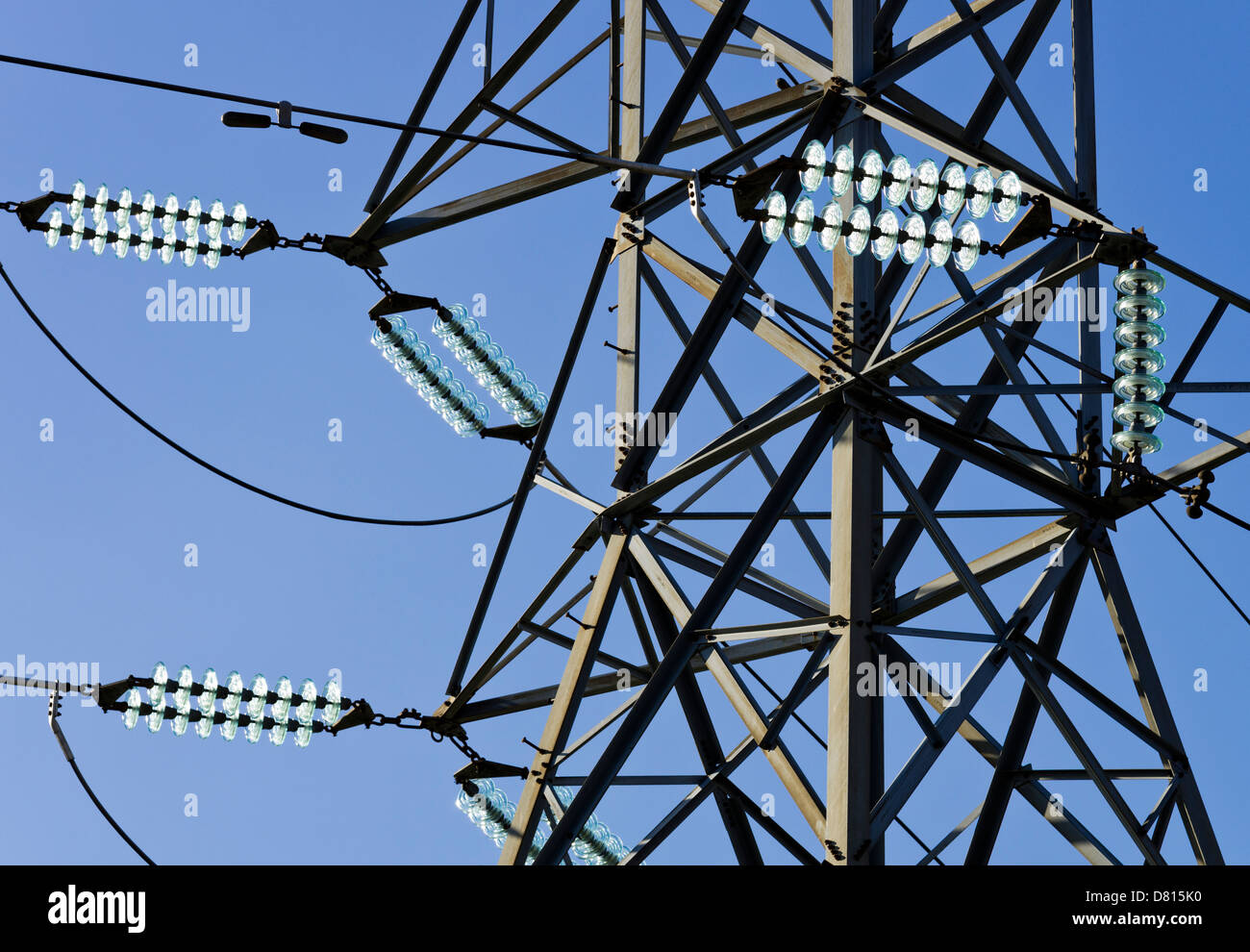 Glass electricity insulators and electricity pylon Stock Photo Alamy
