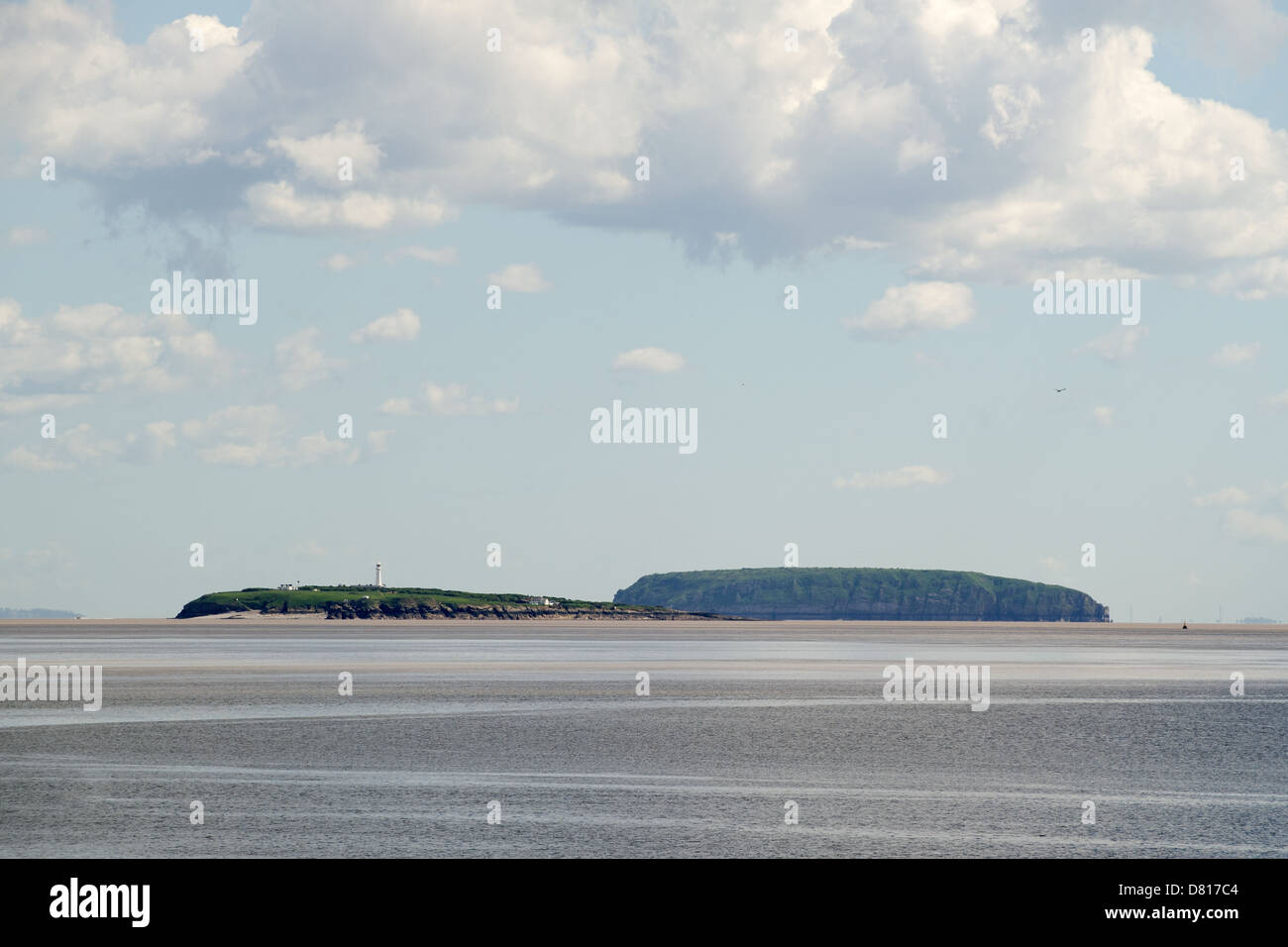 Islands Flat Holm (L, Wales) and Steep Holm (R, England), as seen from the Cardiff Bay barrage. Stock Photo