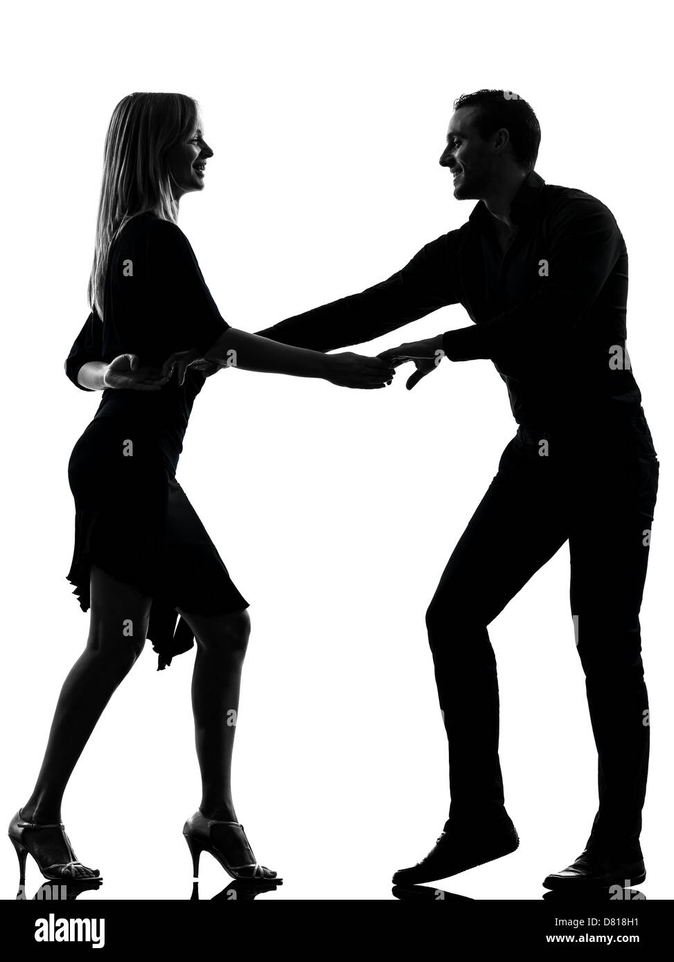 one  couple woman man dancing dancers salsa rock in silhouette studio isolated on white background Stock Photo