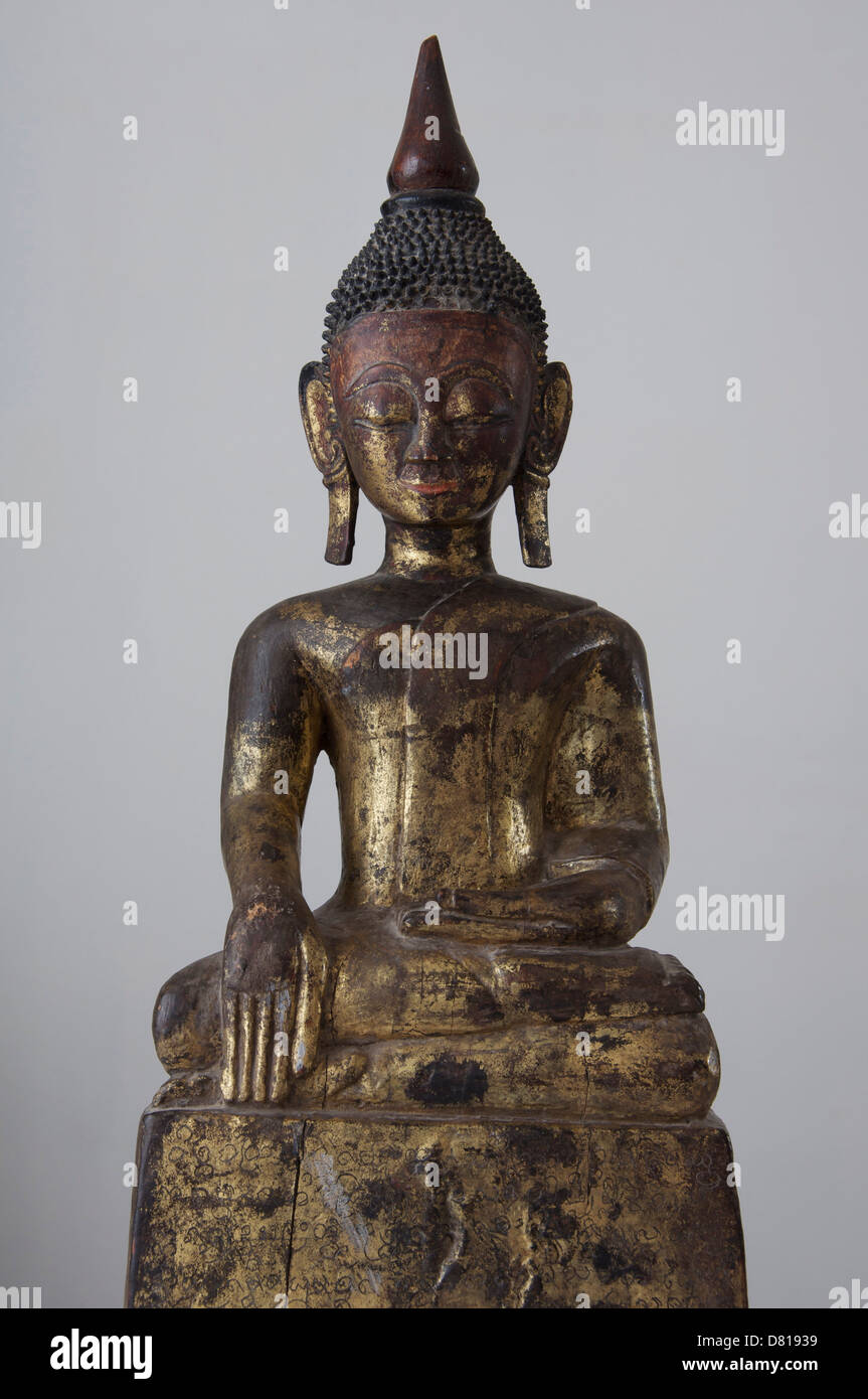 Antique wooden statue of the Buddha meditating. It is the most common