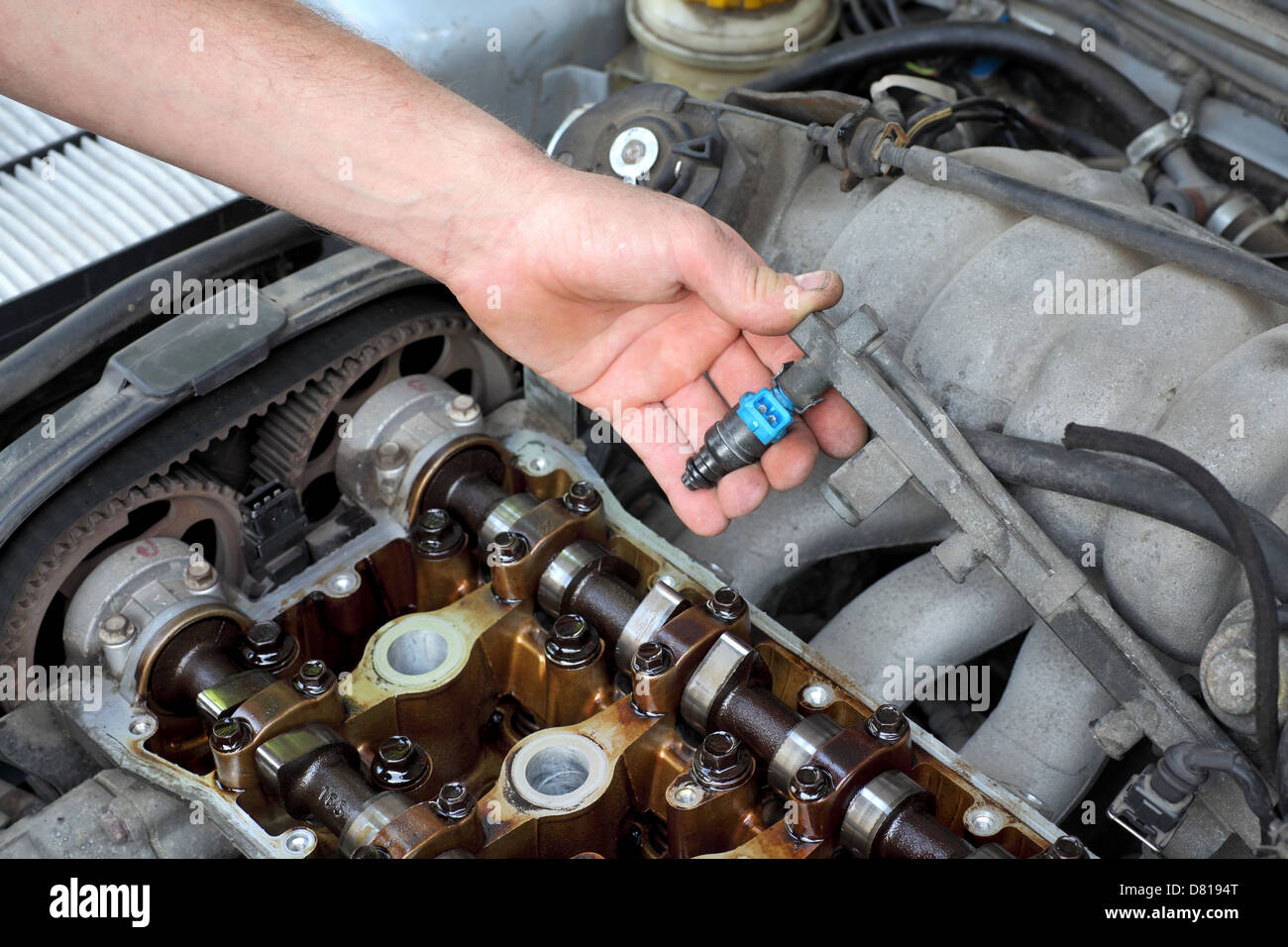 2005 Nissan Altima For Sale >> Car mechanic fixing fuel injector at two camshaft gasoline ... 2005 Nissan Altima For Sale >> Car mechanic fixing fuel injector at two camshaft gasoline ...