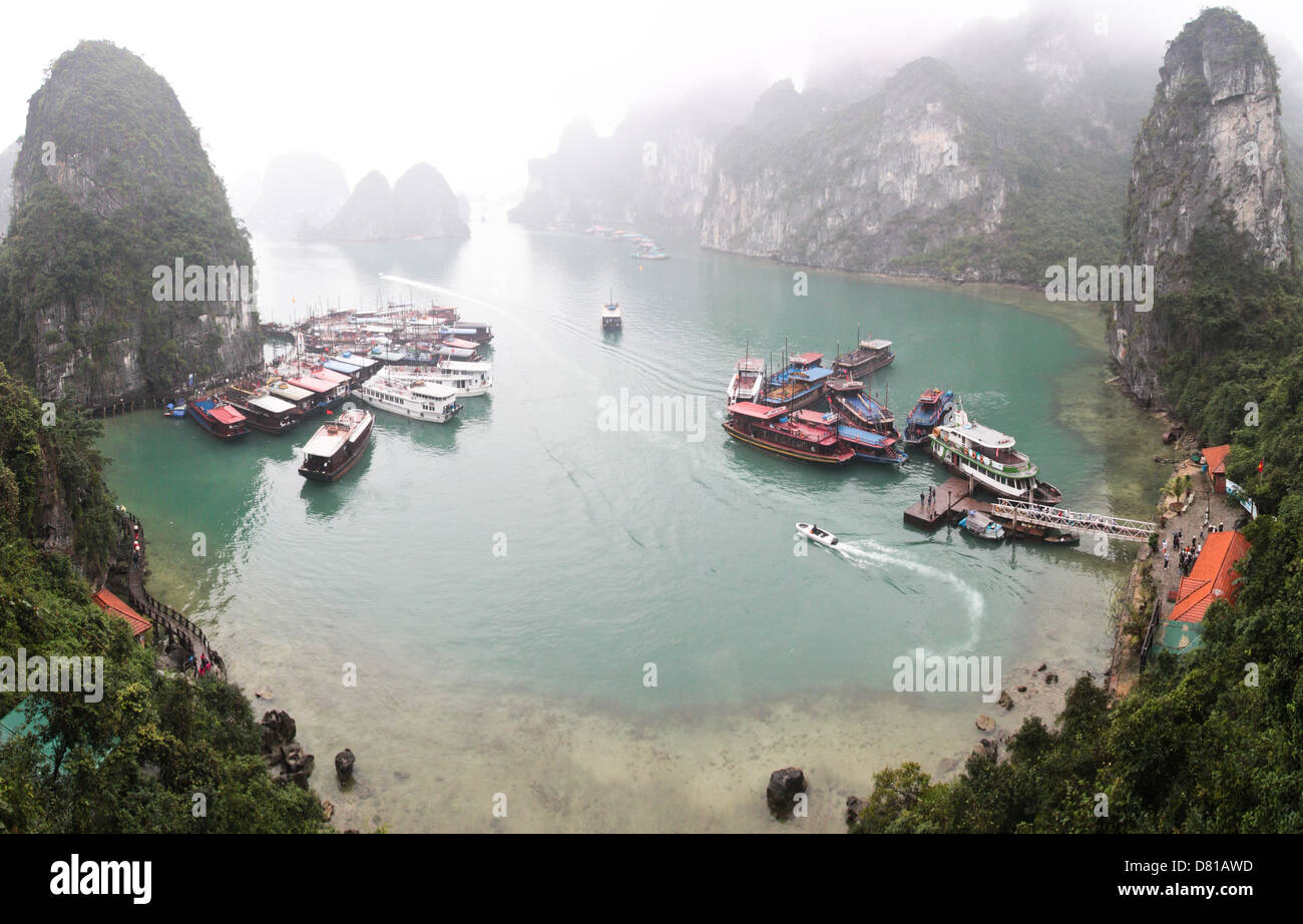 A panorama view from Sung Sot Cave in Halong bay during the winter season, when fog cover the mogotes. Stock Photo