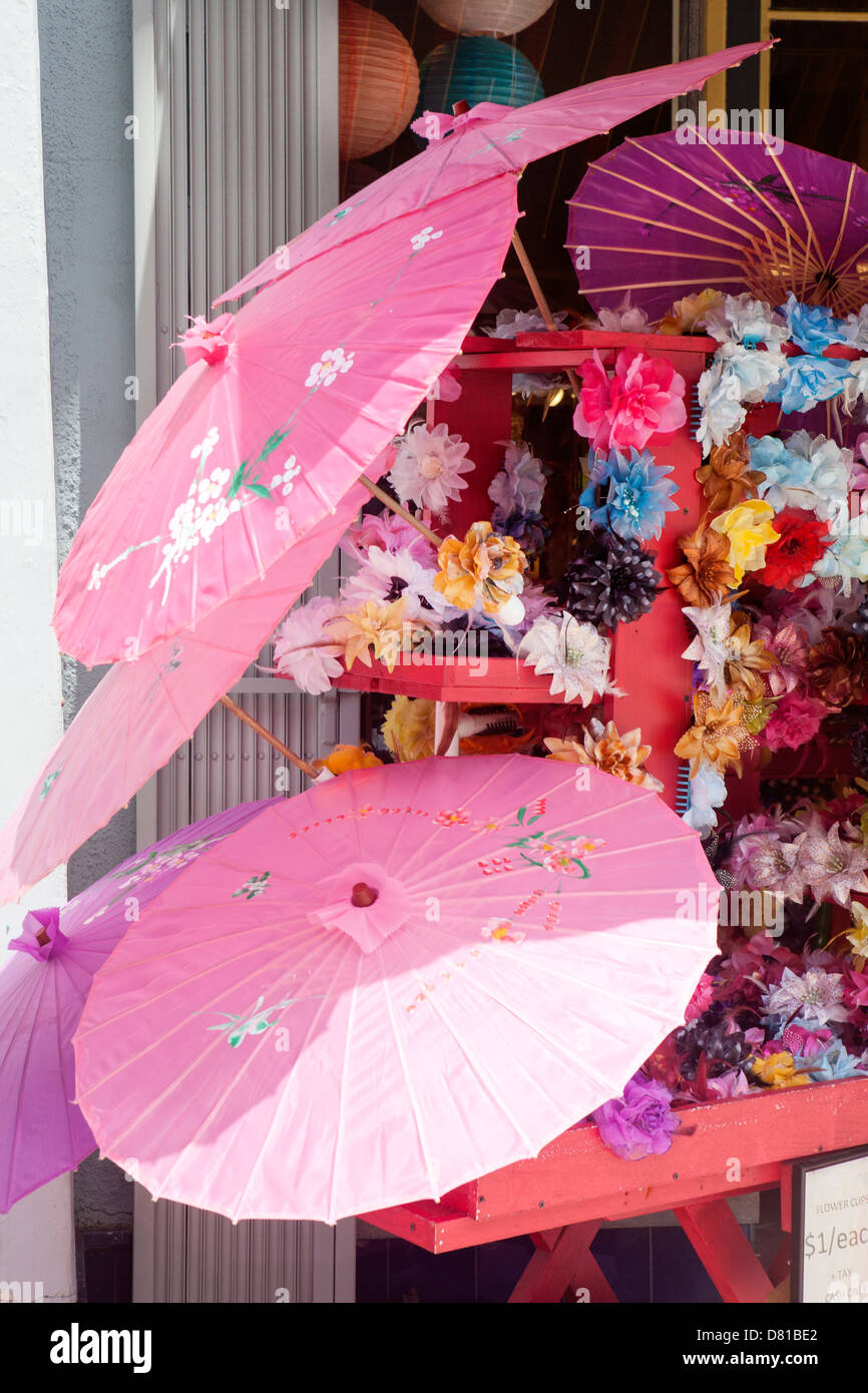 Pink Parasols and flowers in Chinatown Stock Photo