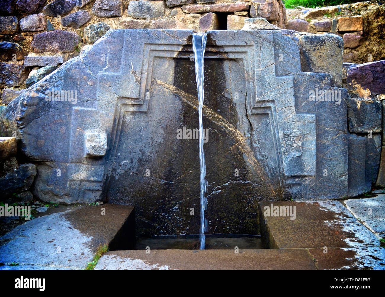 Stone water fountain at the Inca site of Ollantaytambo, Peru Stock Photo