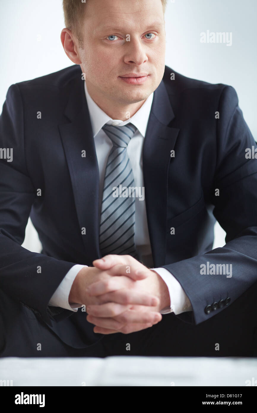 A young serious businessman in suit looking at camera Stock Photo - Alamy